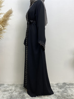Side view of elegant Maheen abaya with belt