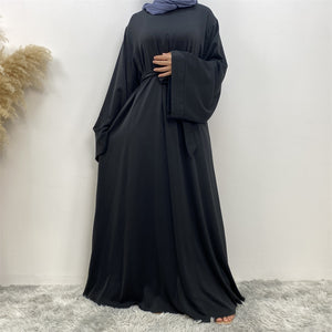 Front view of Hira abaya with elegant flow and pleated belt styling