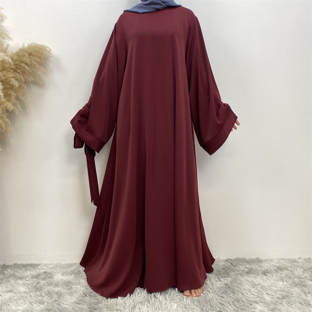 Front view of Hira abaya with elegant flow and pleated belt styling