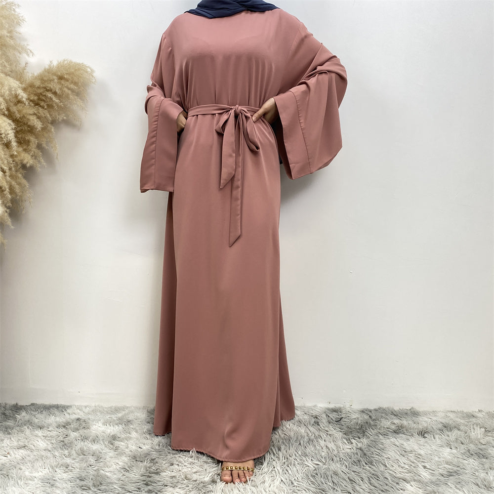 Front view of Hira abaya with elegant flow and pleated belt styling