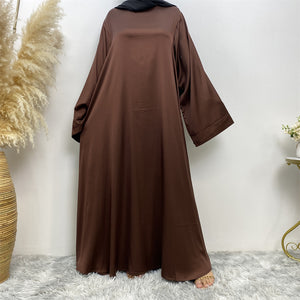 Side view of Hira satin abaya showing satin sheen and graceful drape