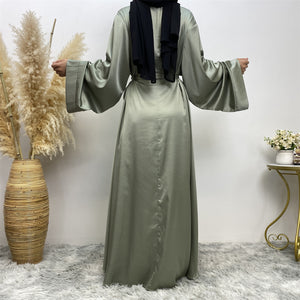 Back view of Hira satin abaya showing satin sheen and graceful drape