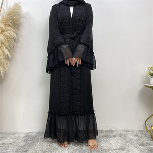 Close-up of lace trim on black chiffon ruffle abaya
