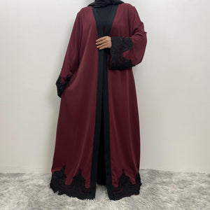 Modest black trim abaya with luxury flow and side pockets
