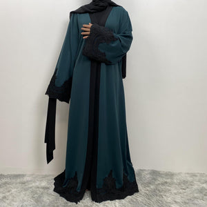 Modest black trim abaya with luxury flow and side pockets