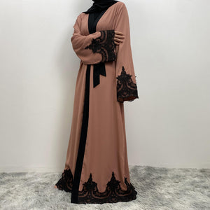 Modest black trim abaya with luxury flow and side pockets