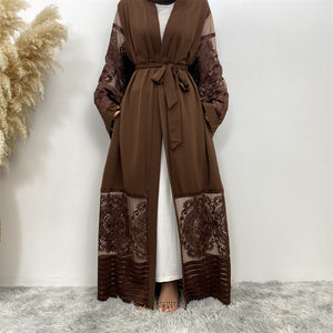 Front view of Arya open abaya in nidha fabric with sheer lace trim and matching belt