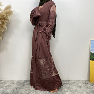 Side view of Arya open abaya showing modest flow, lace detail, and practical pockets