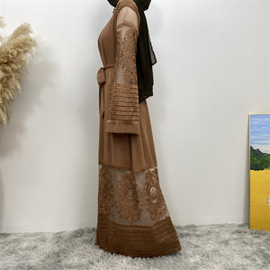 Side view of Arya open abaya showing modest flow, lace detail, and practical pockets