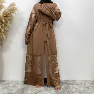 Front view of Arya open abaya showing modest flow, lace detail, and practical pockets