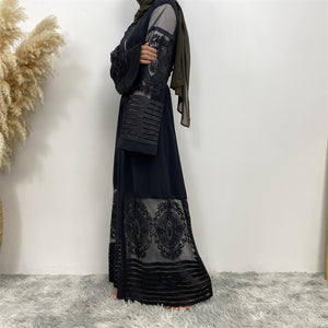 Side view of Arya open abaya showing modest flow, lace detail, and practical pockets