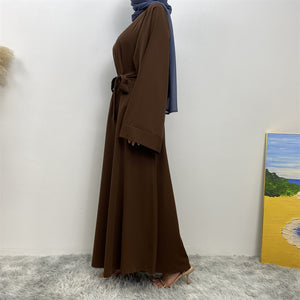 Side view of Hira abaya in nidha fabric showing modest flow