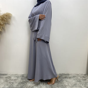 Side view of Hira abaya in nidha fabric showing modest flow