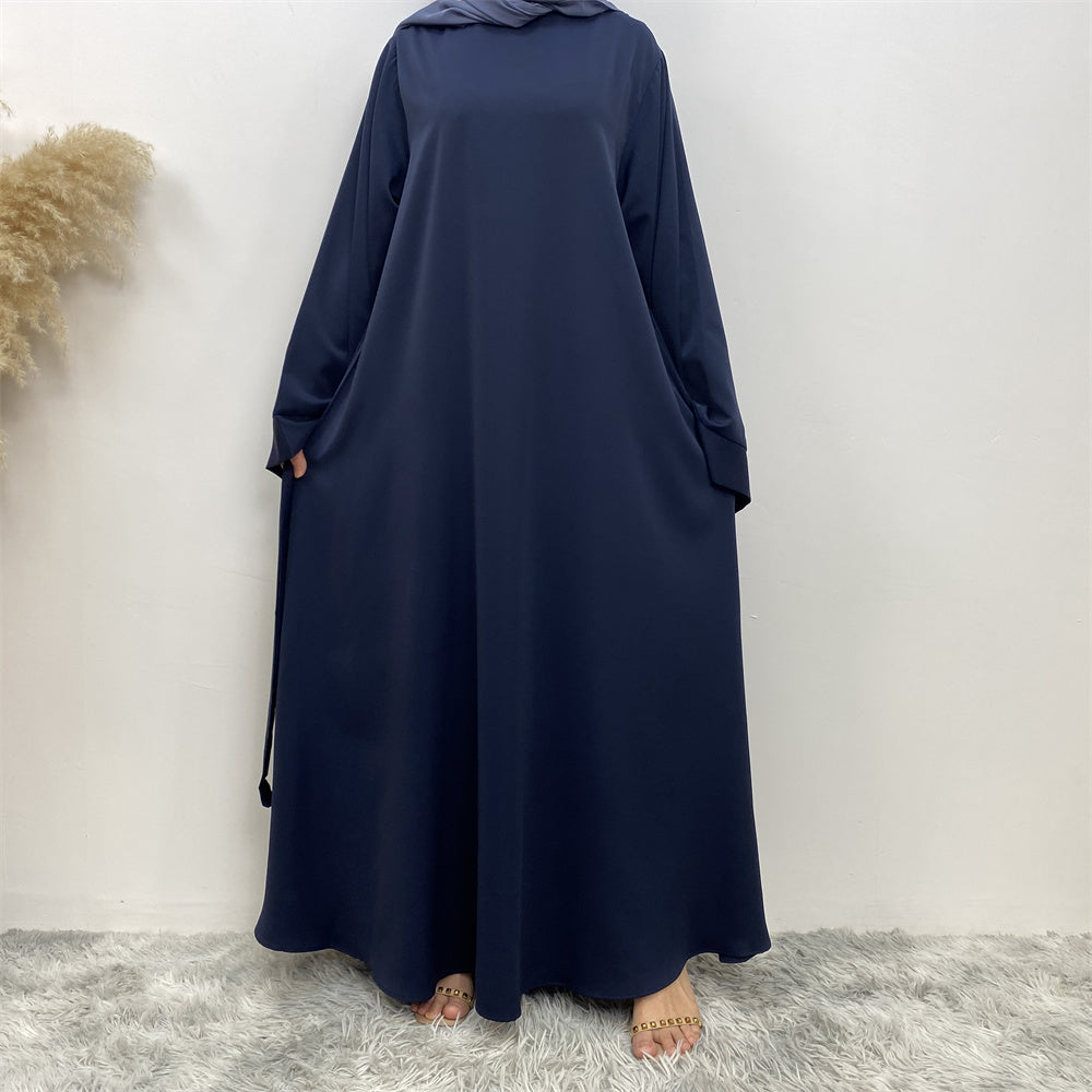 Front view of Hira abaya with elegant flow and pleated belt styling