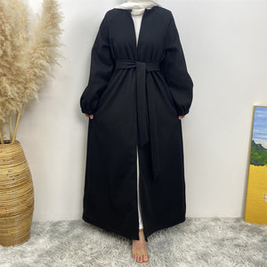 Front view of thick winter abaya coat with elasticated sleeves
