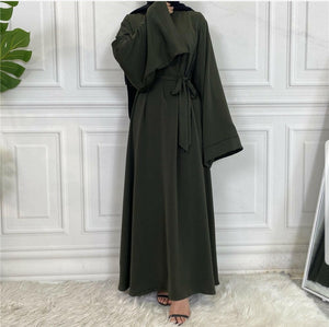 Front view of Hira abaya with elegant flow and pleated belt styling