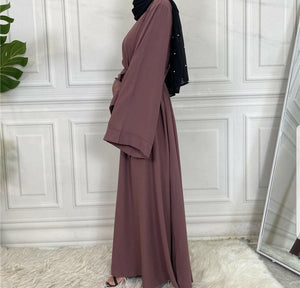 Side view of Hira abaya in nidha fabric showing modest flow
