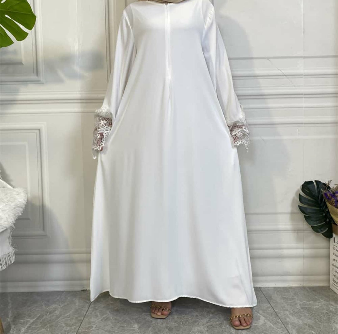 White Aira abaya with luxury lace trim sleeves and matching belt, crafted from premium nidha fabric.