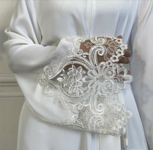 Elegant nursing-friendly white abaya with invisible zip, lace trim sleeves, and invisible side pockets.