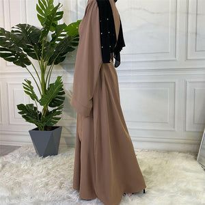 Side view of Hira abaya in nidha fabric showing modest flow