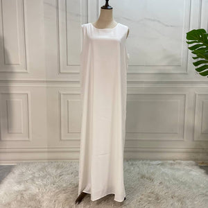 White sleeveless abaya slip dress made from nidha fabric