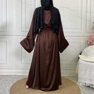 Back view of Hira satin abaya showing satin sheen and graceful drape
