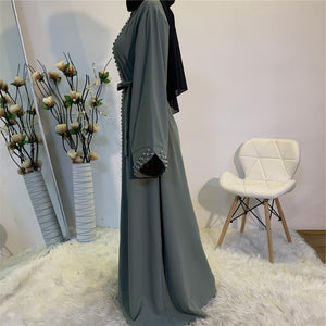 Side view of elegant Maheen abaya with belt