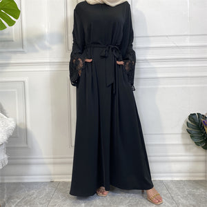 Aira abaya with luxury lace trim sleeves and matching belt, crafted from premium nidha fabric.
