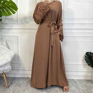 Versatile Aira abaya with practical pockets and elegant lace details, perfect for all occasions.