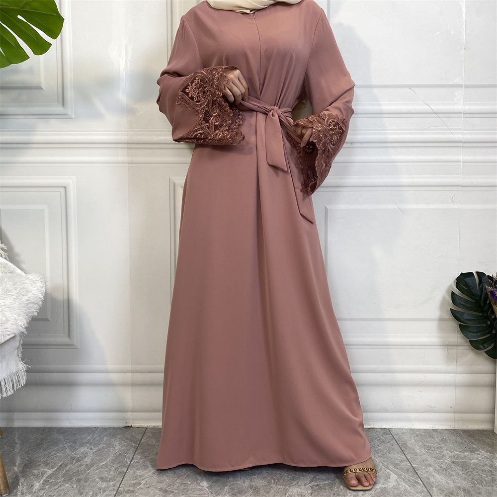 Versatile dusty pink Aira abaya with practical pockets and elegant lace details, perfect for all occasions.