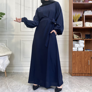 Dina abaya in nidha fabric with loose fit, matching belt and modest flow