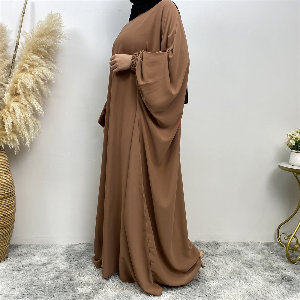 Side view of Fiza Farasha abaya in nidha fabric showing modest flow