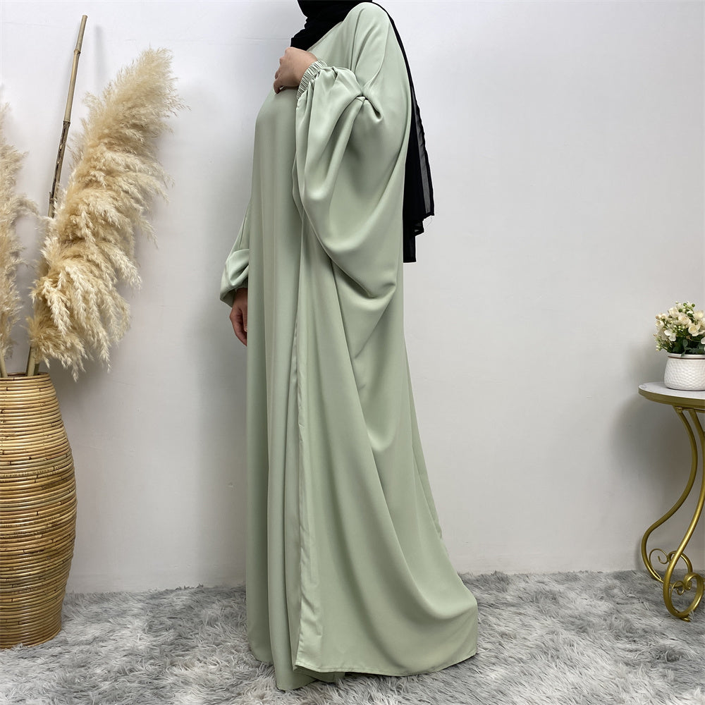 Side view of Fiza Farasha abaya in nidha fabric showing modest flow