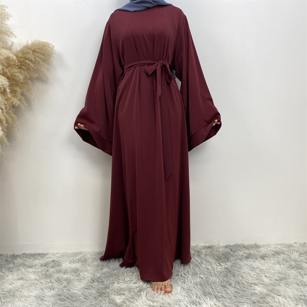 Front view of Hira abaya with elegant flow and pleated belt styling