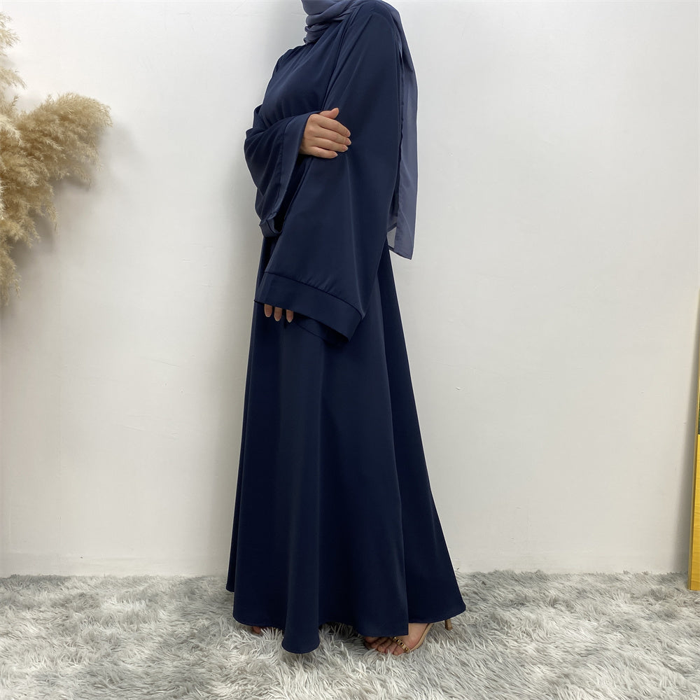 Side view of Hira abaya in nidha fabric showing modest flow