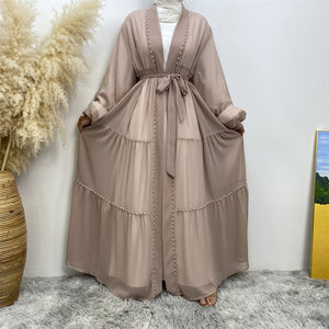 Front view of Gazala abaya with pearls, layered chiffon and matching belt