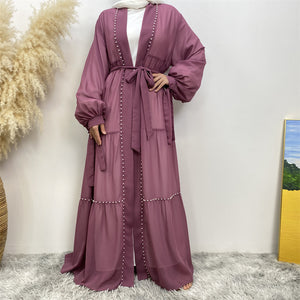 Gazala pearl embellished open abaya layered with slip dress for modest fashion look