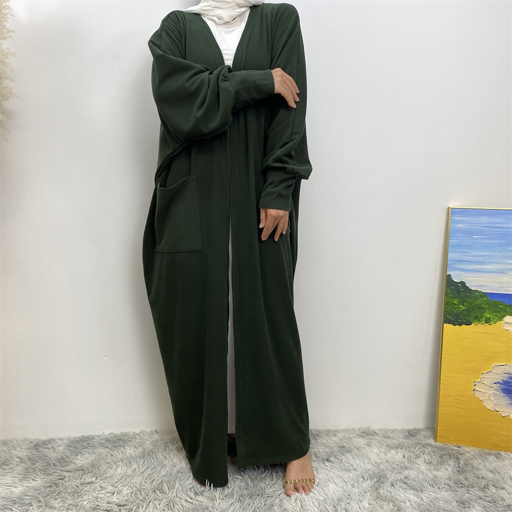 Modest winter coatigan with pockets and ribbed texture