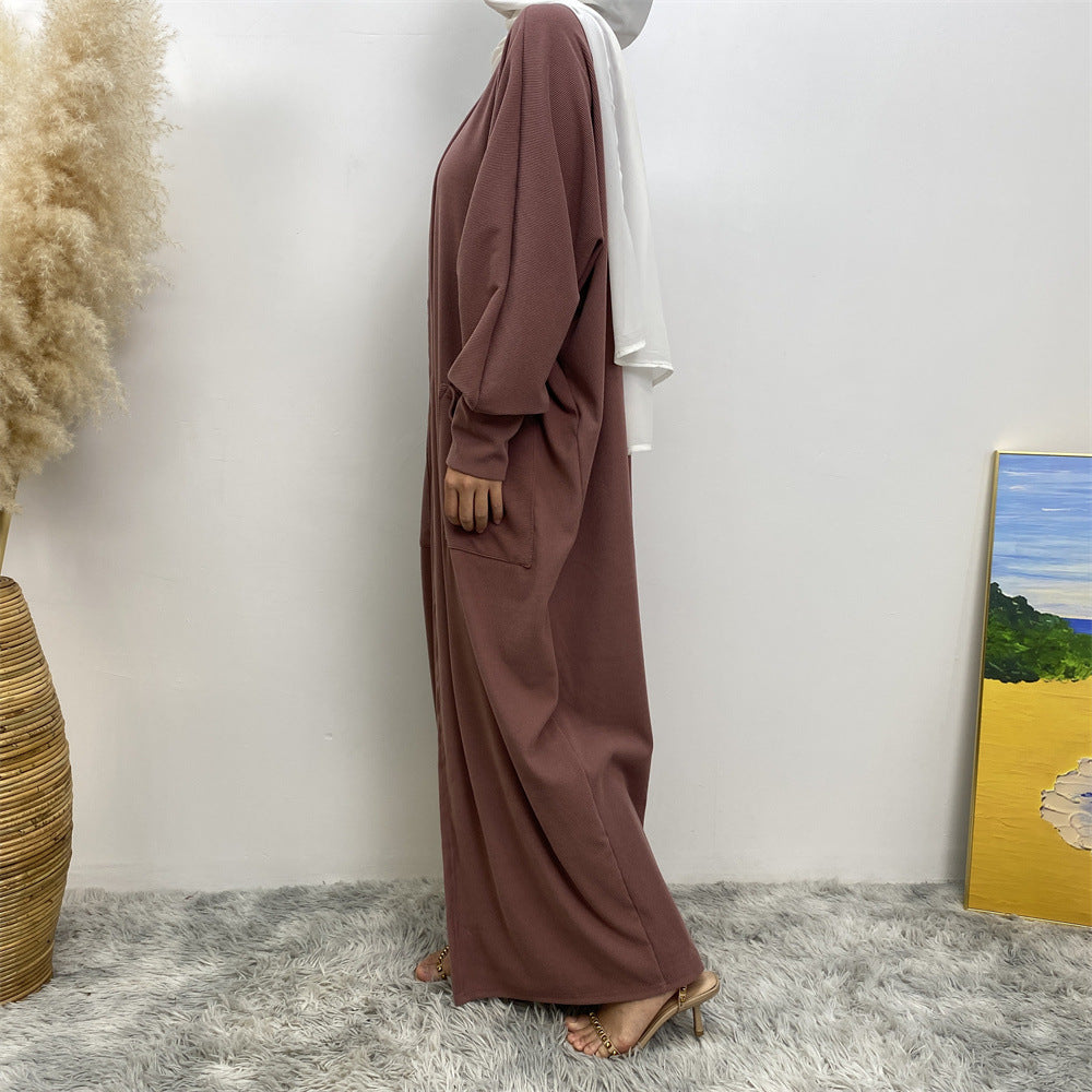 Side view of ribbed knit abaya coatigan with pockets